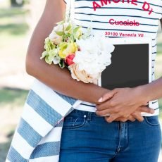 Girl standing with arms across stomach wondering... what is gut health?